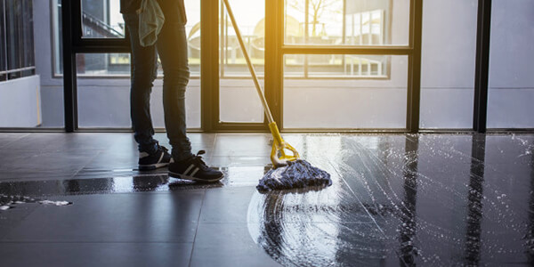 Moping the slate tile floor Moping the slate tile floor