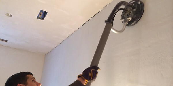 Sanding the Latex Paint by sandpaper Sanding Latex Paint by sandpaper